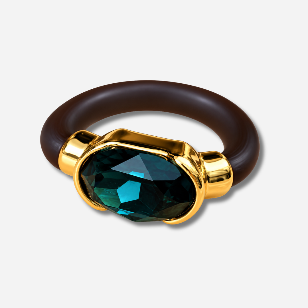 Bague Gala bleu pétrole avec cristal ovale facetté et monture dorée