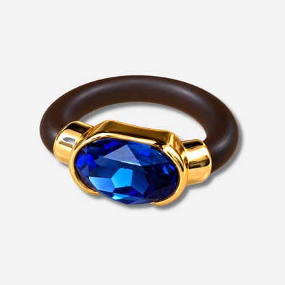 Bague Gala bleu saphir avec cristal ovale facetté et monture dorée