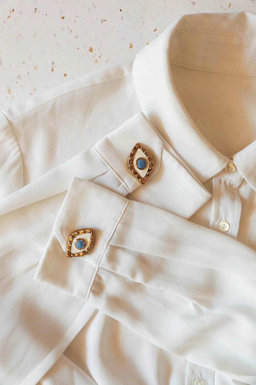 Bijou bouton chemise doré oeil bleu style tendance