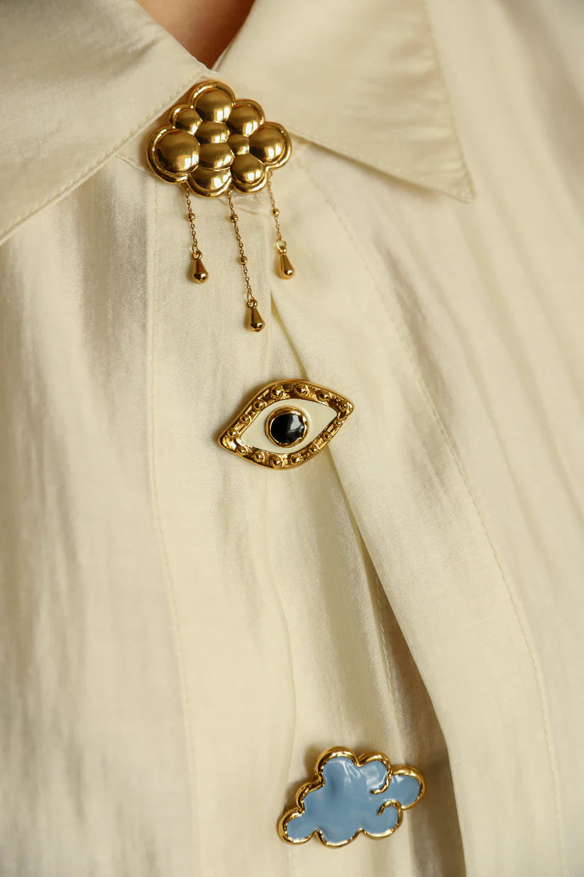 bijou bouton de chemise a clipser oeil noir annee divinity sete