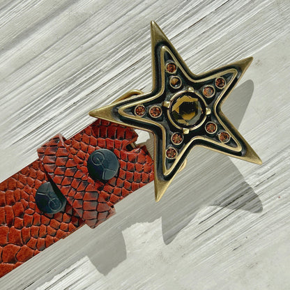 Boucle Yolète étoile dorée détail strass topaze