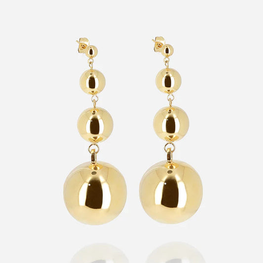 Boucles d’oreilles Adana ZAG en acier inoxydable doré avec trois sphères suspendues