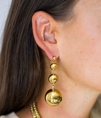 Boucles d’oreilles Adana ZAG en acier inoxydable doré avec trois sphères suspendues