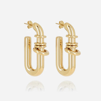 Boucles d’oreilles Edwina ZAG en acier inoxydable doré avec anneaux sculpturaux entrelacés