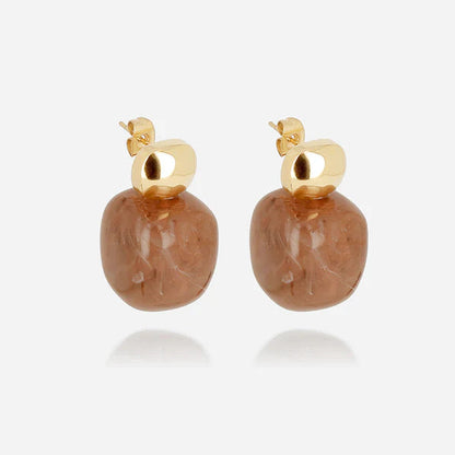 boucles-oreilles-oedipe-zag-resine-acier-dore-divinity-sete.jpg