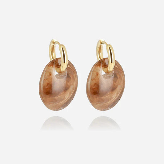 Boucles d’oreilles Prisme ZAG en acier inoxydable doré avec pendentif ovale en résine marbrée
