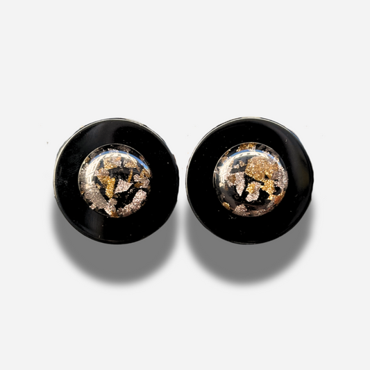 Boucles Rainball Noir Glitter Francine Bramli Paris en résine noire avec centre pailleté doré et argenté