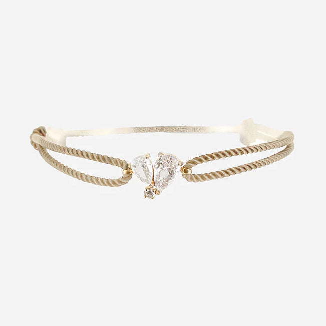 Bracelet Alcmene ZAG avec cordon taupe et papillon en cristaux