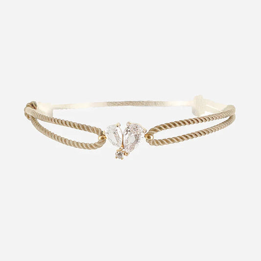 Bracelet Alcmene ZAG avec cordon taupe et papillon en cristaux