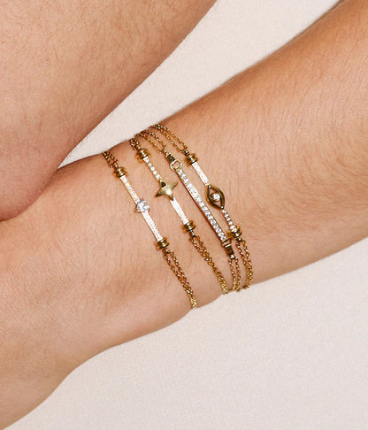 Bracelet Altiani ZAG en acier inoxydable doré avec motif œil protecteur et zircon central