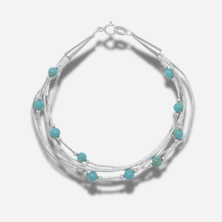 Bracelet B487 Harpo en argent massif liquid silver avec perles de turquoise naturelle fabriqué à la main selon la tradition Navajo.
