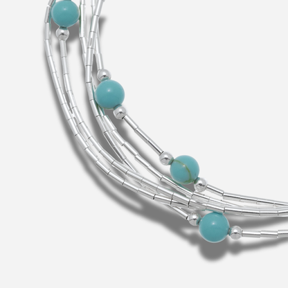 Bracelet B487 Harpo en argent massif liquid silver avec perles de turquoise naturelle fabriqué à la main selon la tradition Navajo.