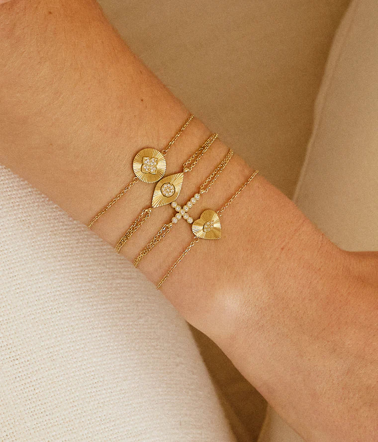 Bracelet Capizzi ZAG en acier inoxydable doré avec croix sertie de zirconiums