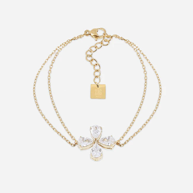 Bracelet Estial ZAG en acier inoxydable doré avec fleur à quatre pétales en cristaux