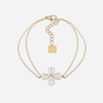 Bracelet Estial ZAG en acier inoxydable doré avec fleur à quatre pétales en cristaux
