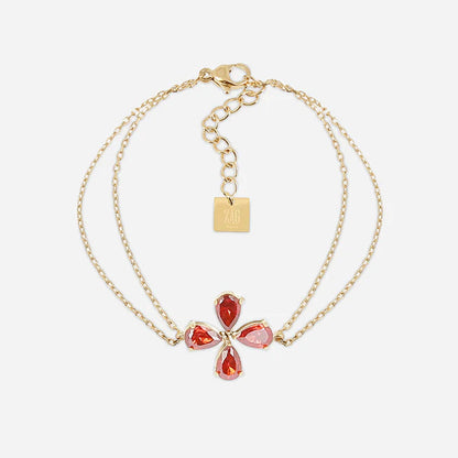 Bracelet Estial ZAG en acier inoxydable doré avec fleur à quatre pétales en cristaux