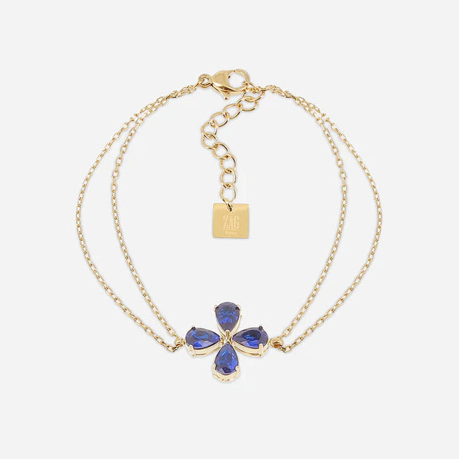 Bracelet Estial ZAG en acier inoxydable doré avec fleur à quatre pétales en cristaux