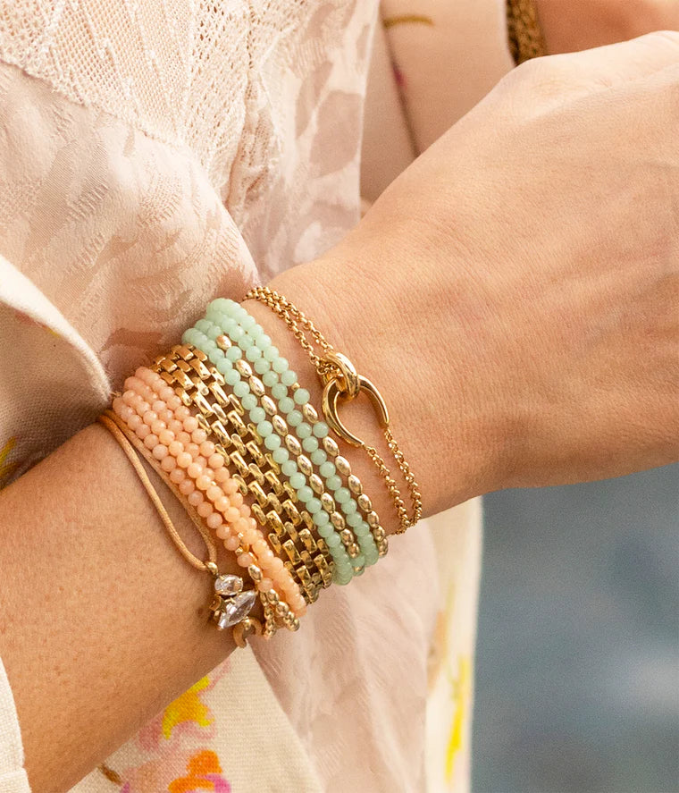 Bracelet Felik ZAG en acier inoxydable doré avec double chaîne et anneaux entrelacés