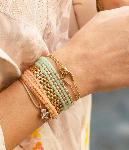 Bracelet Felik ZAG en acier inoxydable doré avec double chaîne et anneaux entrelacés