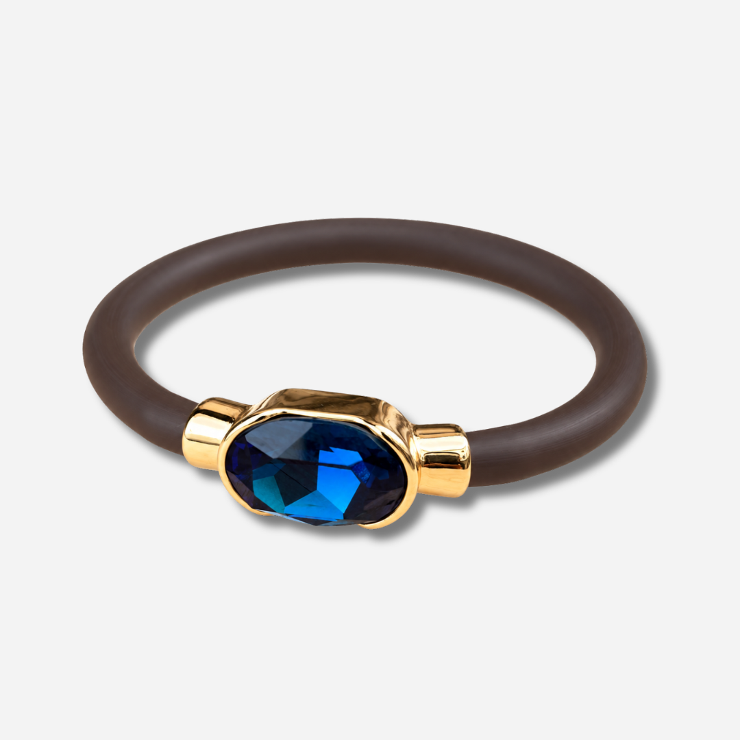 Bracelet Gala Bleu Nuit avec cristal ovale facetté bleu profond, monture dorée et bracelet marron