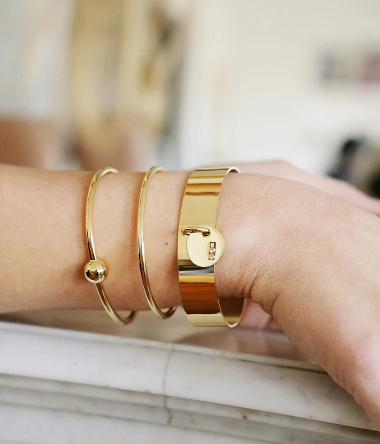 Bracelet jonc Bianca ZAG acier inoxydable doré avec boule centrale bracelet femme Divinity Sète
