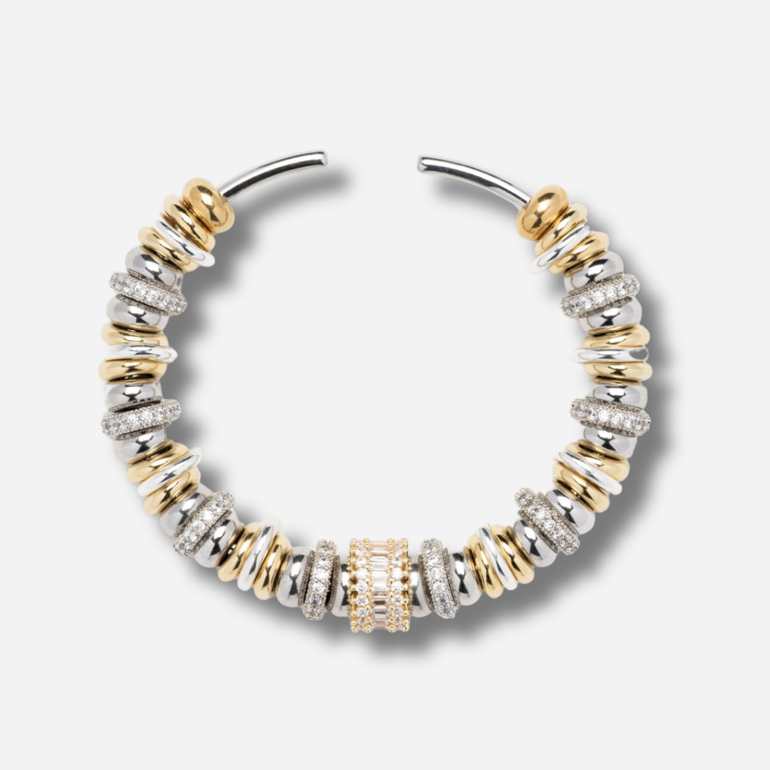 Bracelet jonc Sigal Luma bicolore or et argent avec anneaux sertis d'oxydes de zirconium, bijou chic et élégant.