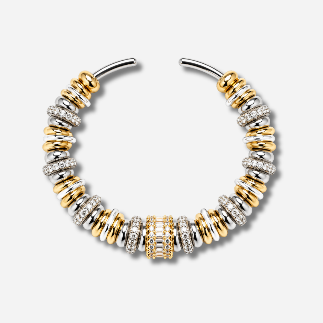 Bracelet jonc Sigal Luma bicolore or et argent avec anneaux sertis d'oxydes de zirconium, bijou chic et élégant.