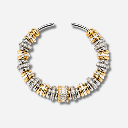 Bracelet jonc Sigal Luma bicolore or et argent avec anneaux sertis d'oxydes de zirconium, bijou chic et élégant.