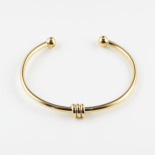 Bracelet jonc Pei ZAG acier inoxydable doré jonc ouvert avec embouts boule et anneaux femme Divinity Sète