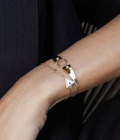 Bracelet Marcello ZAG en acier inoxydable doré avec design géométrique, anneau central et zirconiums