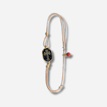 Bracelet Nonza Croix Noir Amadrina Corse avec croix dorée, paillettes noires et perle de corail
