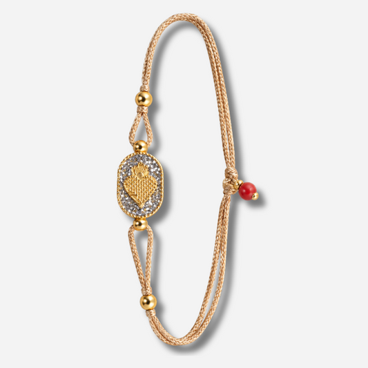Bracelet Nonza Ex-Voto Argent Amadrina sur cordon réglable avec Ex-Voto doré, pavage de paillettes argentées et perle de corail naturelle