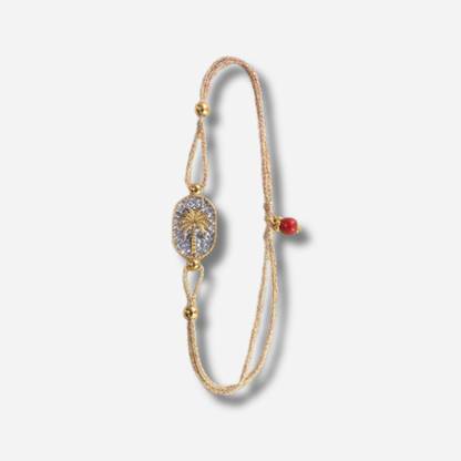 Bracelet Nonza Palmier Argent Amadrina sur cordon réglable avec palmier doré, pavage de paillettes argentées et perle de corail naturelle