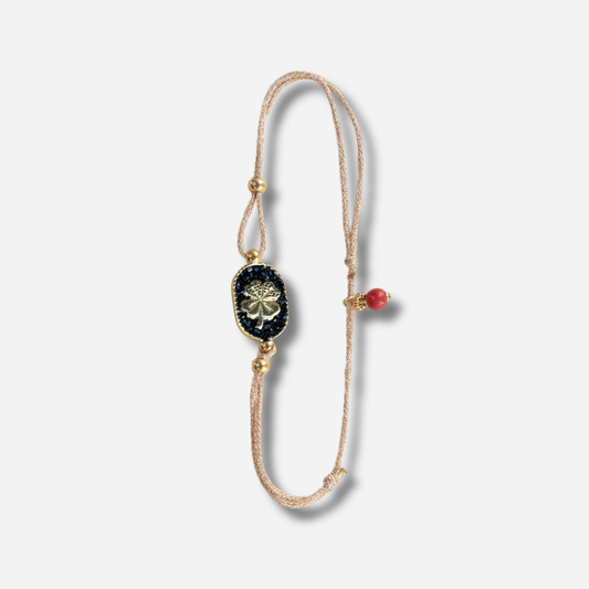 Bracelet Nonza Trèfle Noir Amadrina Corse avec médaillon noir pailleté et trèfle doré
