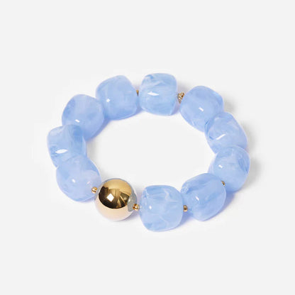 Bracelet Œdipe ZAG en grosses perles de résine colorée avec perle dorée
