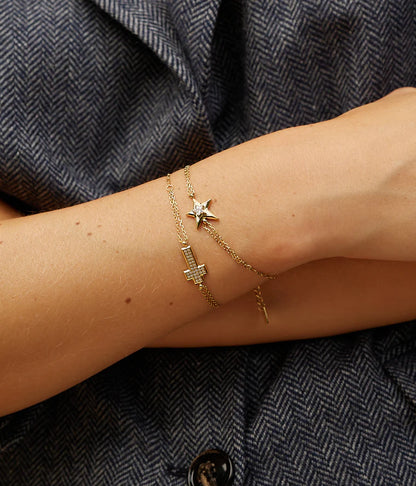 Bracelet Ondine ZAG en acier doré avec croix pavée de zirconiums
