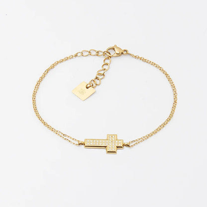 Bracelet Ondine ZAG en acier doré avec croix pavée de zirconiums