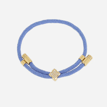 Bracelet Rezza ZAG en acier inoxydable doré avec motif trèfle serti de zirconiums et cordon coloré