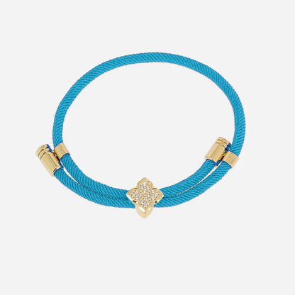 Bracelet Rezza ZAG en acier inoxydable doré avec motif trèfle serti de zirconiums et cordon coloré