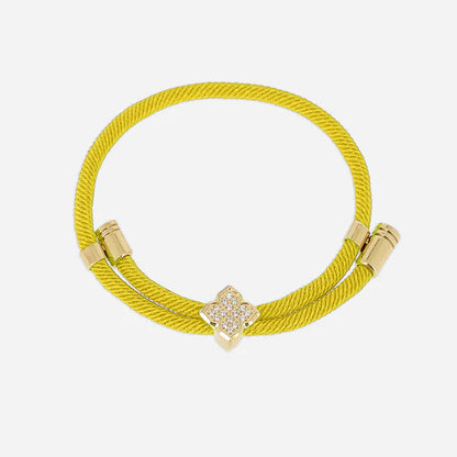 Bracelet Rezza ZAG en acier inoxydable doré avec motif trèfle serti de zirconiums et cordon coloré