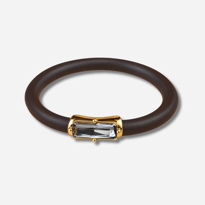 Bracelet Riva Gris avec cristal rectangulaire facetté gris, monture dorée et bracelet marron