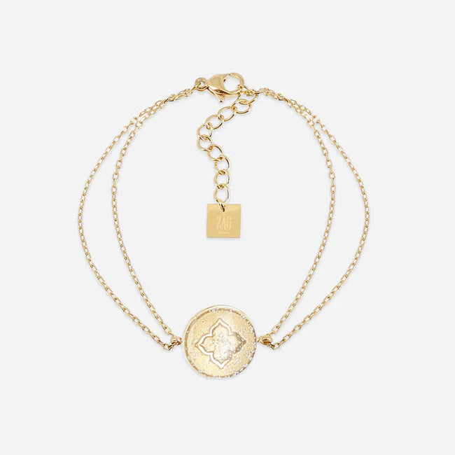 Bracelet Root ZAG en acier inoxydable doré avec médaille texturée et nacre blanche