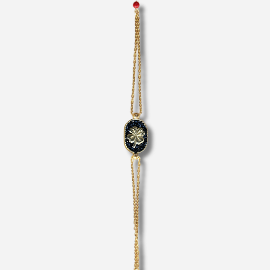 Bracelet Santa Giulia Trèfle Noir Amadrina Corse avec trèfle doré, paillettes noires et double chaîne dorée
