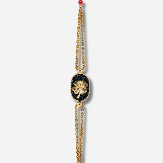 Bracelet Santa Giulia Trèfle Noir Amadrina Corse avec trèfle doré, paillettes noires et double chaîne dorée
