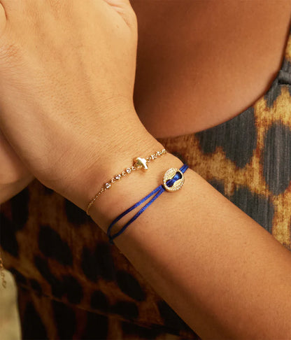 Bracelet Shanks ZAG en acier inoxydable doré avec trèfle central et zirconiums