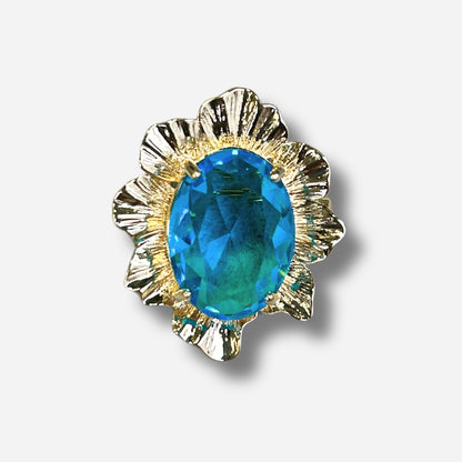 Détail broche corolle bleu pierre facettée