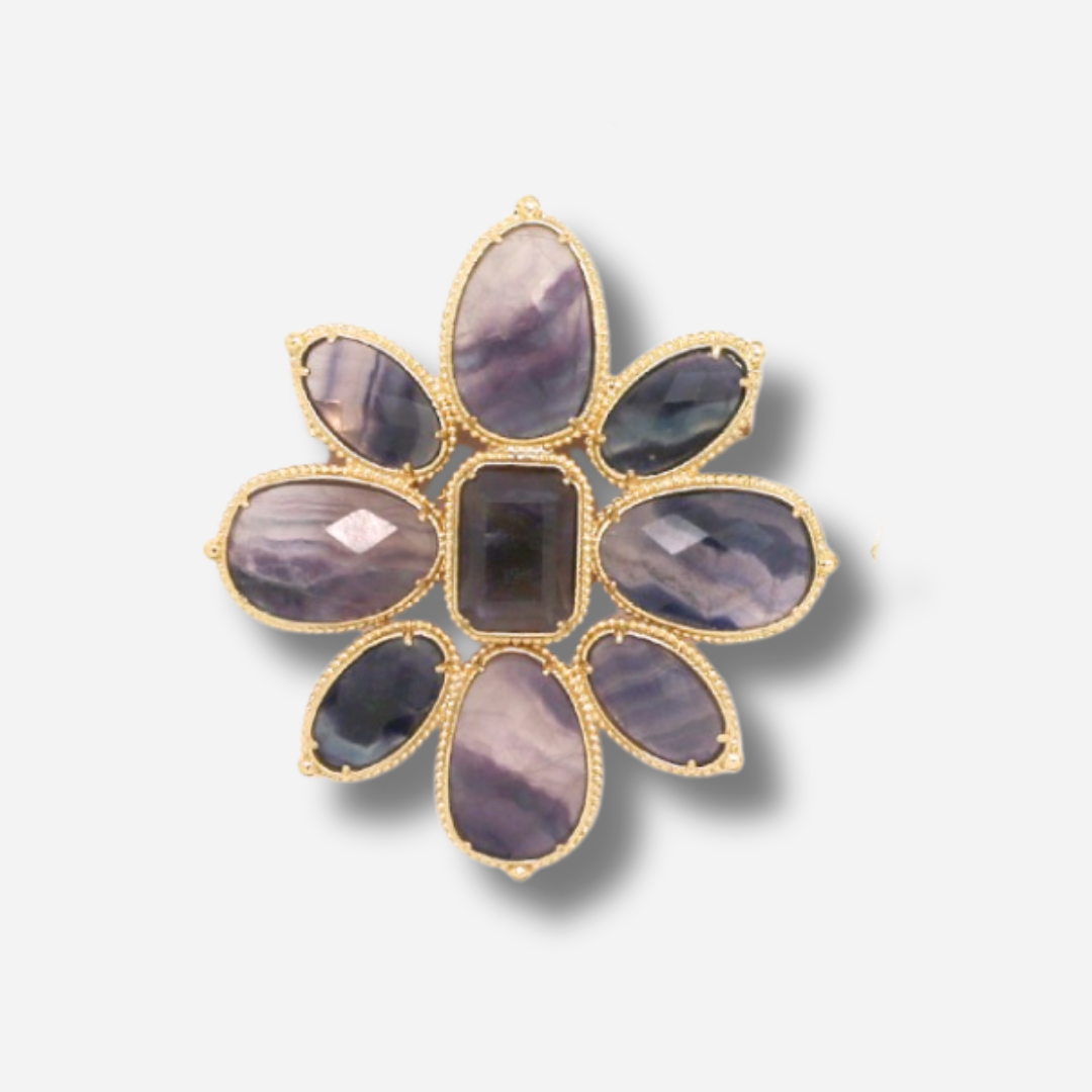 Broche bijou femme fleur violette aux pierres facettées sur monture dorée