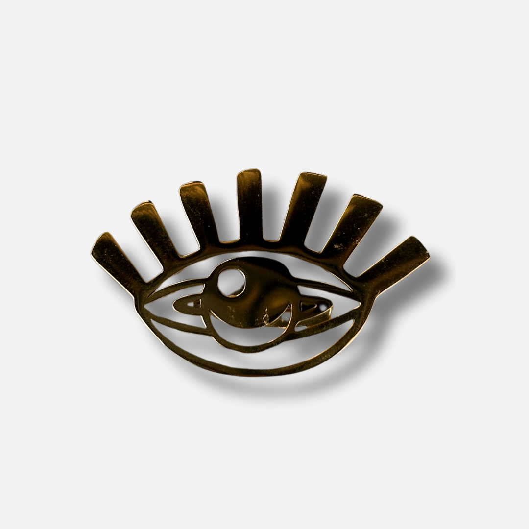 Broche bijou femme œil doré au design graphique