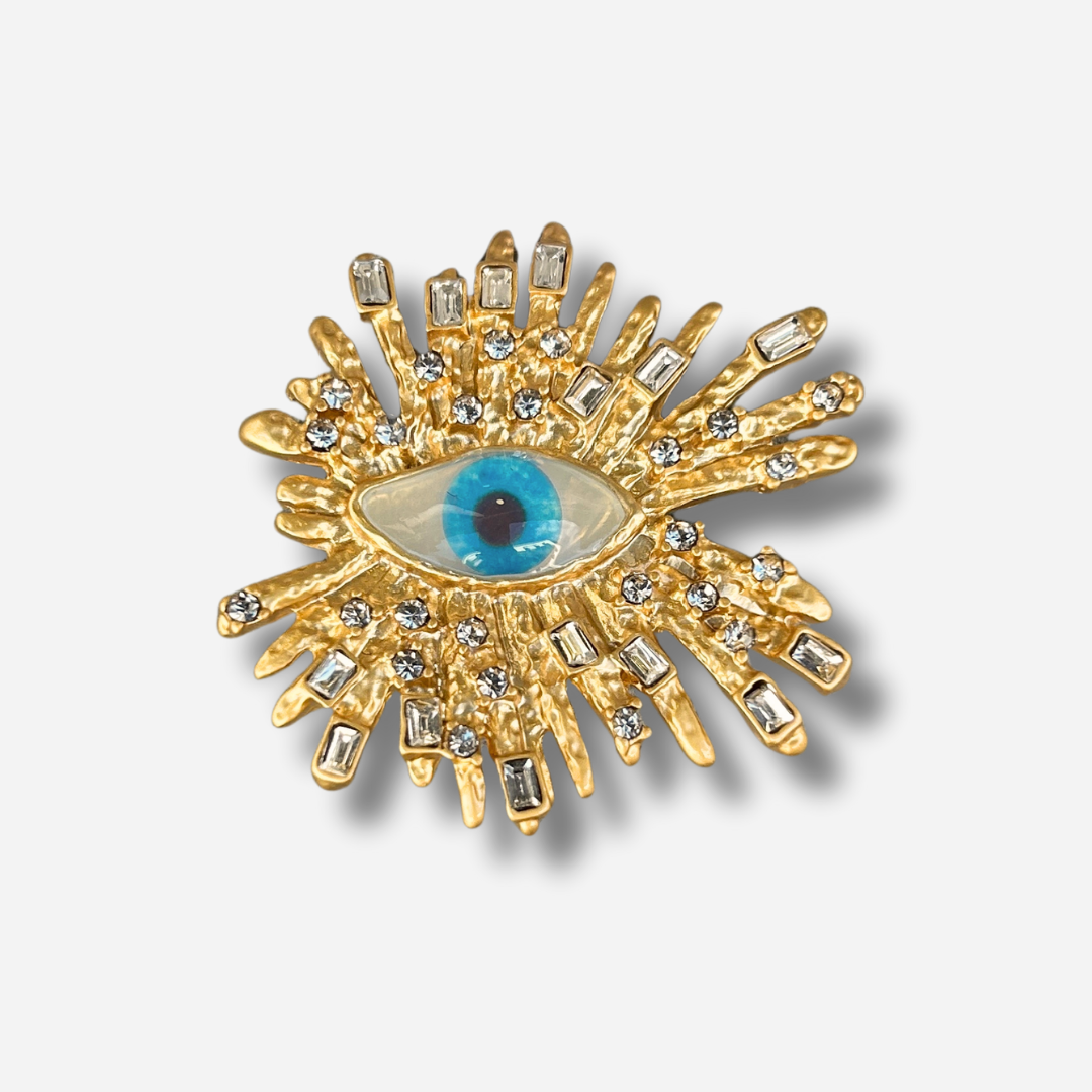 Broche bijou femme œil soleil doré avec cabochon bleu et strass