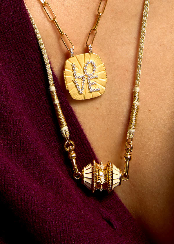 Collier talisman ivoire et doré Mya Bay